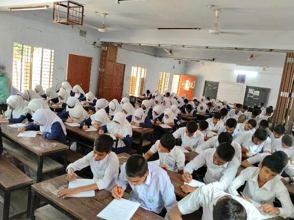 Students completing the pre-test questionnaire in a classroom